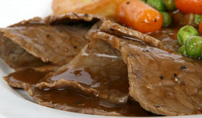 Thinly sliced beef with light gravey.