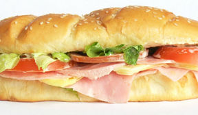 Submarie sandwich with assorted meat and vegitables.